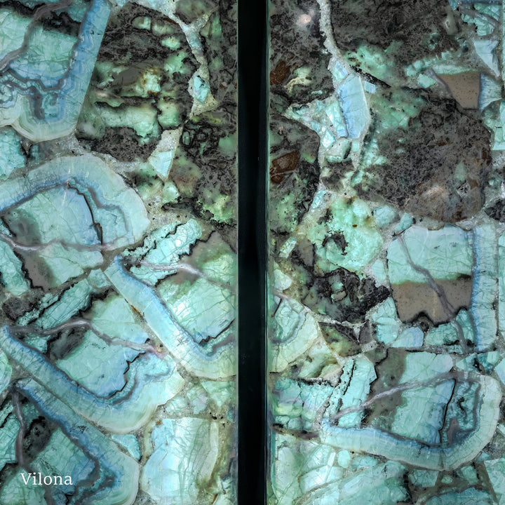 Fluorite crystal wall panel pair close-up with turquoise layers, veins, and dark areas