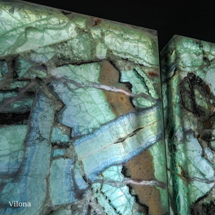 Fluorite crystal wall panel pair angled close-up with teal-green marbling and brown streaks