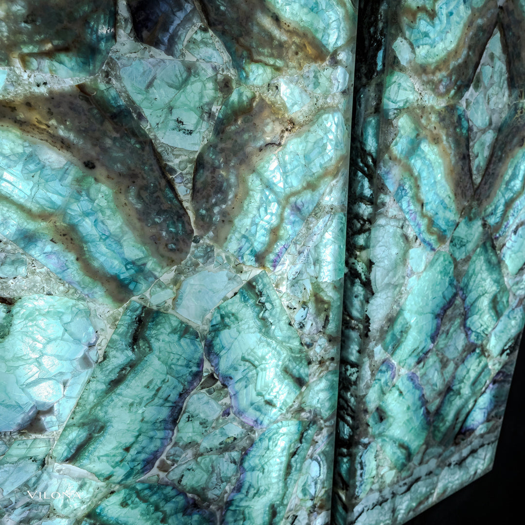 Teal fluorite wall panels detail: faceted stone facets, specks, and dark vein patterns.