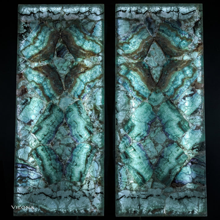Fluorite crystal wall panels set: two teal stone panels with faceted starburst motifs.
