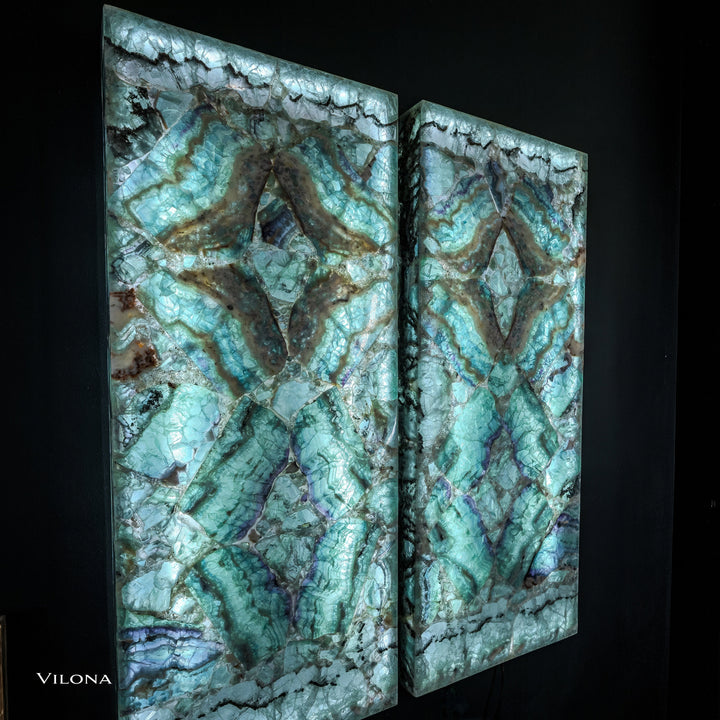 Fluorite crystal wall panel pair with teal swirls and centered star motifs in cracked stone.