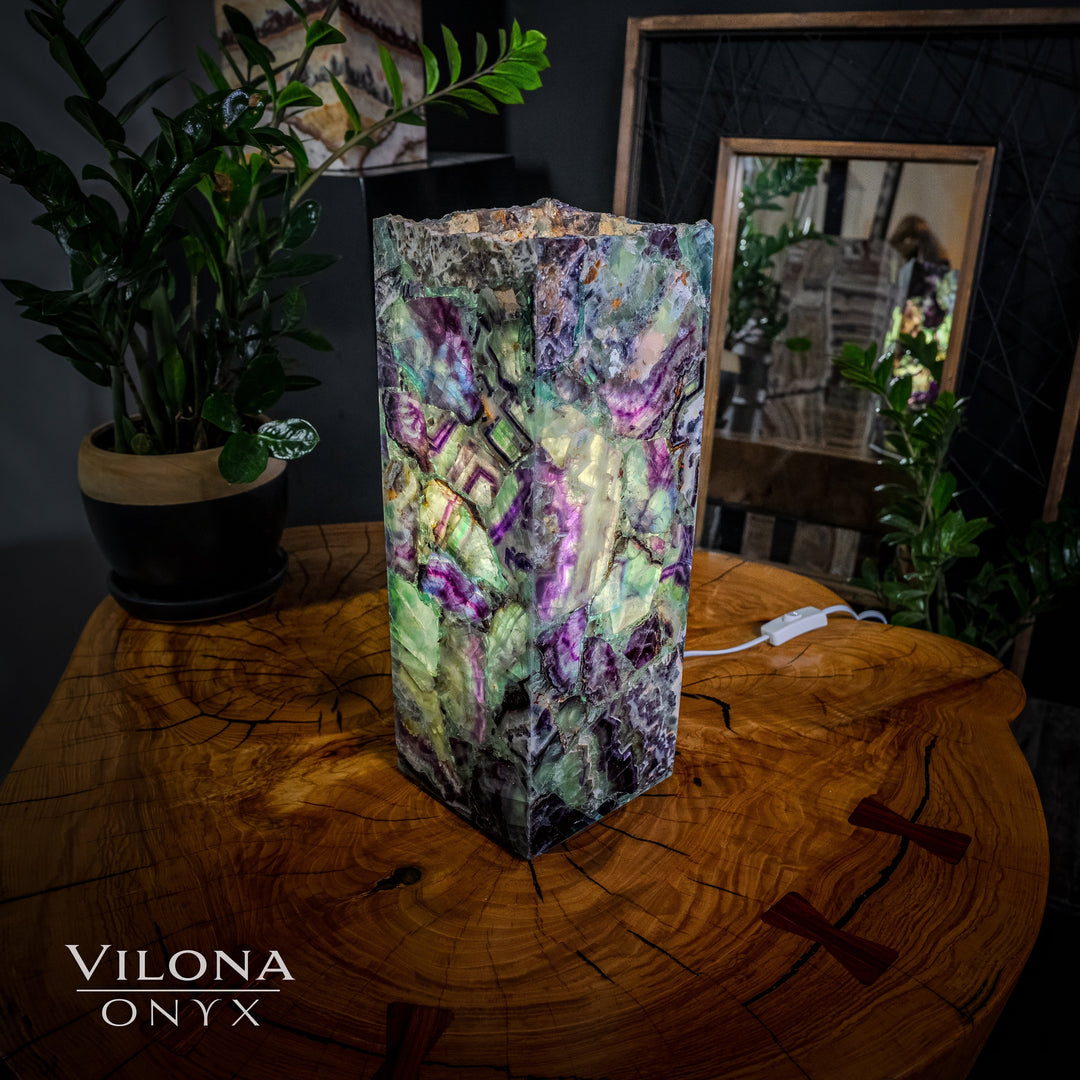 Small fluorite table lamp with bright green and purple faceted prism shade