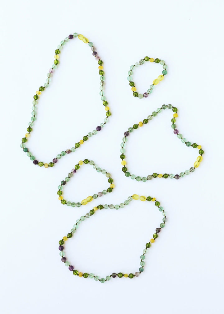 Bead gemstone necklace set: three looping strands in green, yellow, and purple