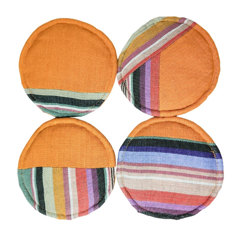 Circular woven coasters, four round orange designs with multicolor horizontal stripe panels