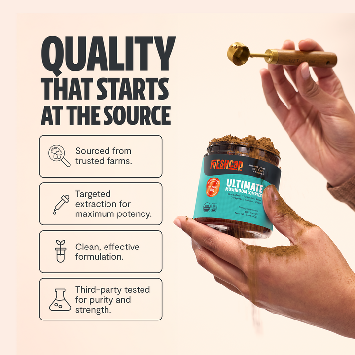 Freshcap Ultimate mushroom complex jar held in hand, teal label with black lid