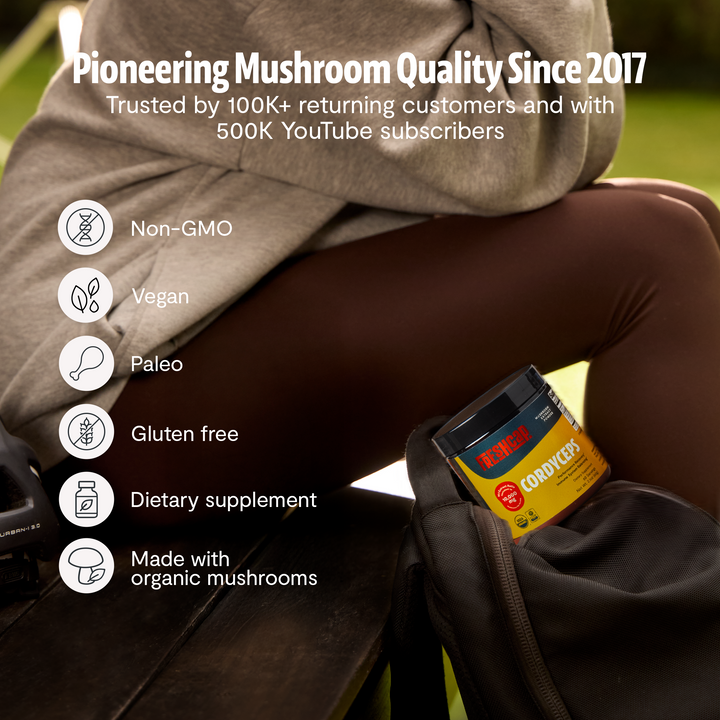 Cordyceps mushroom supplement jar on lap with quality icons like non-GMO and vegan