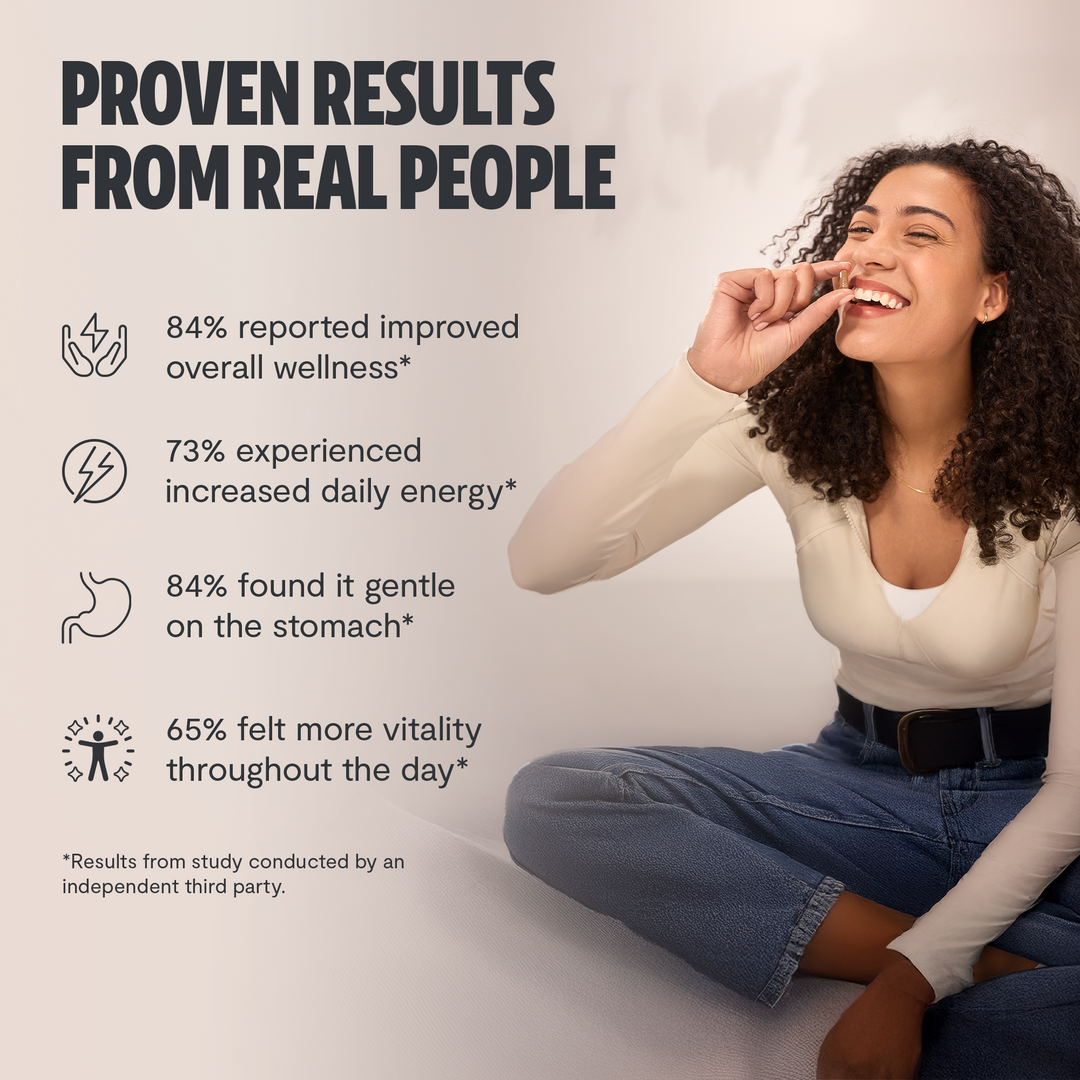 Person sitting and smiling while holding a spoon, wellness results theme