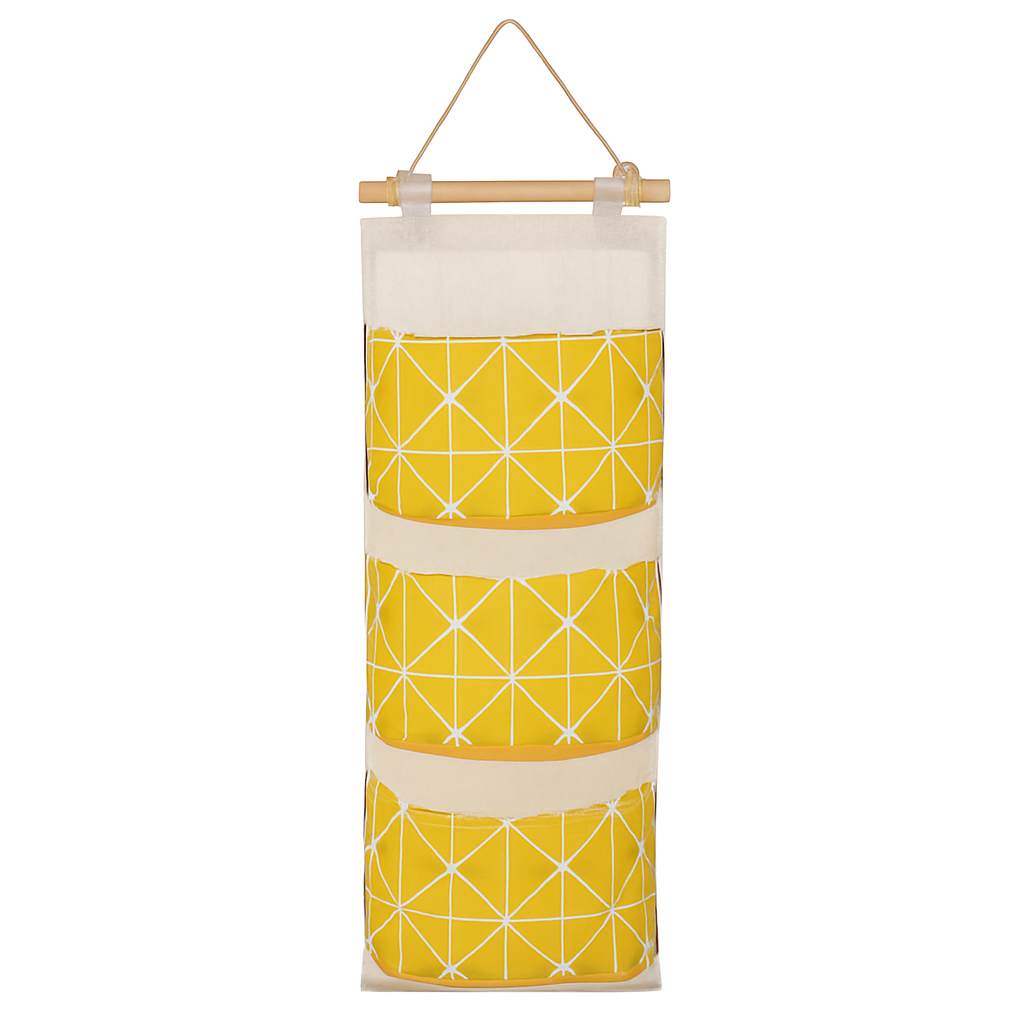 Yellow and white patterned wall storage organizer bag with three fabric pockets
