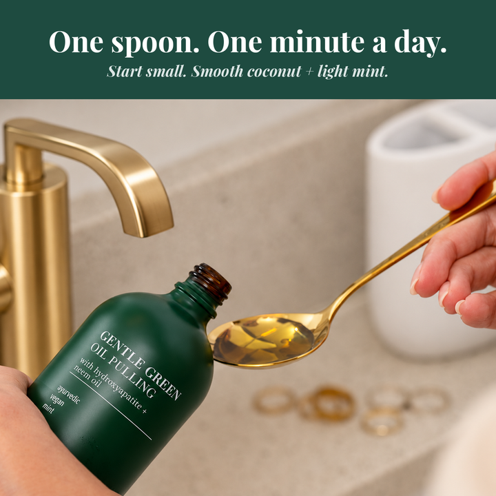 Gentle green oil pulling bottle with golden oil on spoon near bathroom faucet