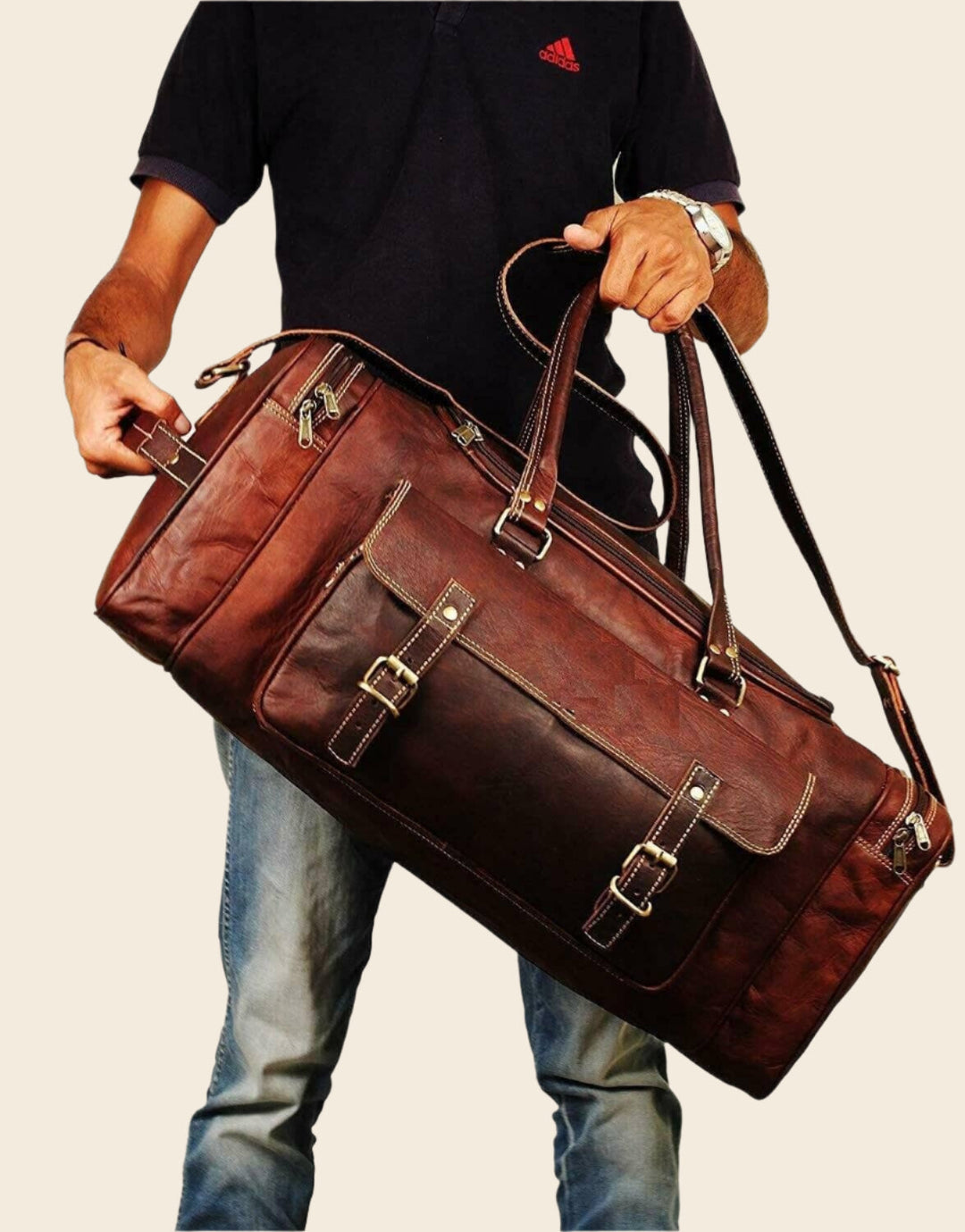 Brown leather duffel bag with dual side pockets and shoulder strap, carried diagonally