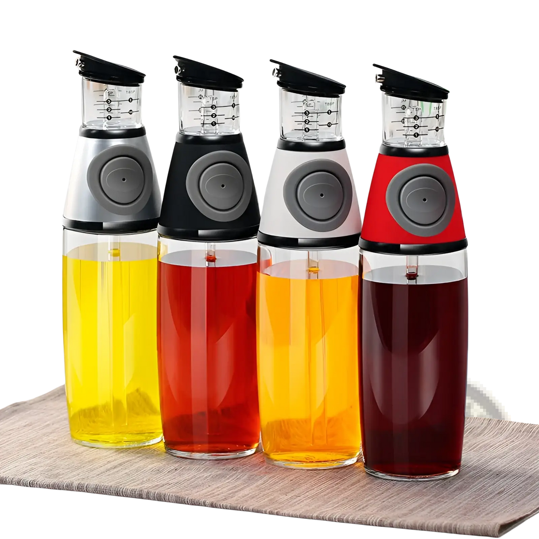Glass oil dispenser set with precision measuring cup and colored bottles for dispensing oil.