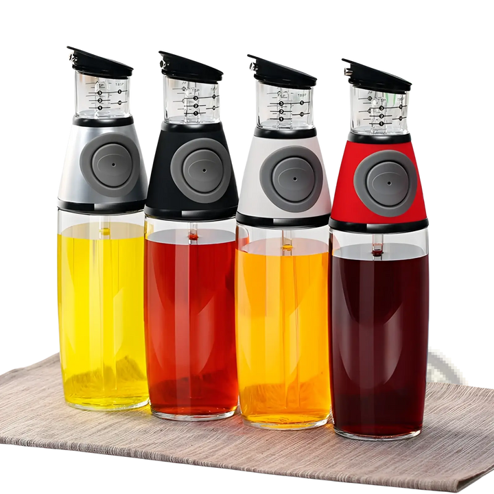 Glass oil dispenser set with precision measuring cup and colored bottles for dispensing oil.