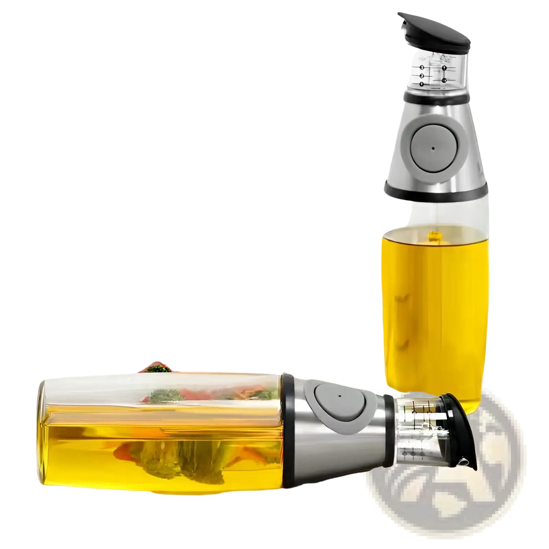 Glass oil dispenser with precision measuring cup, silver base, and yellow oil reservoir.