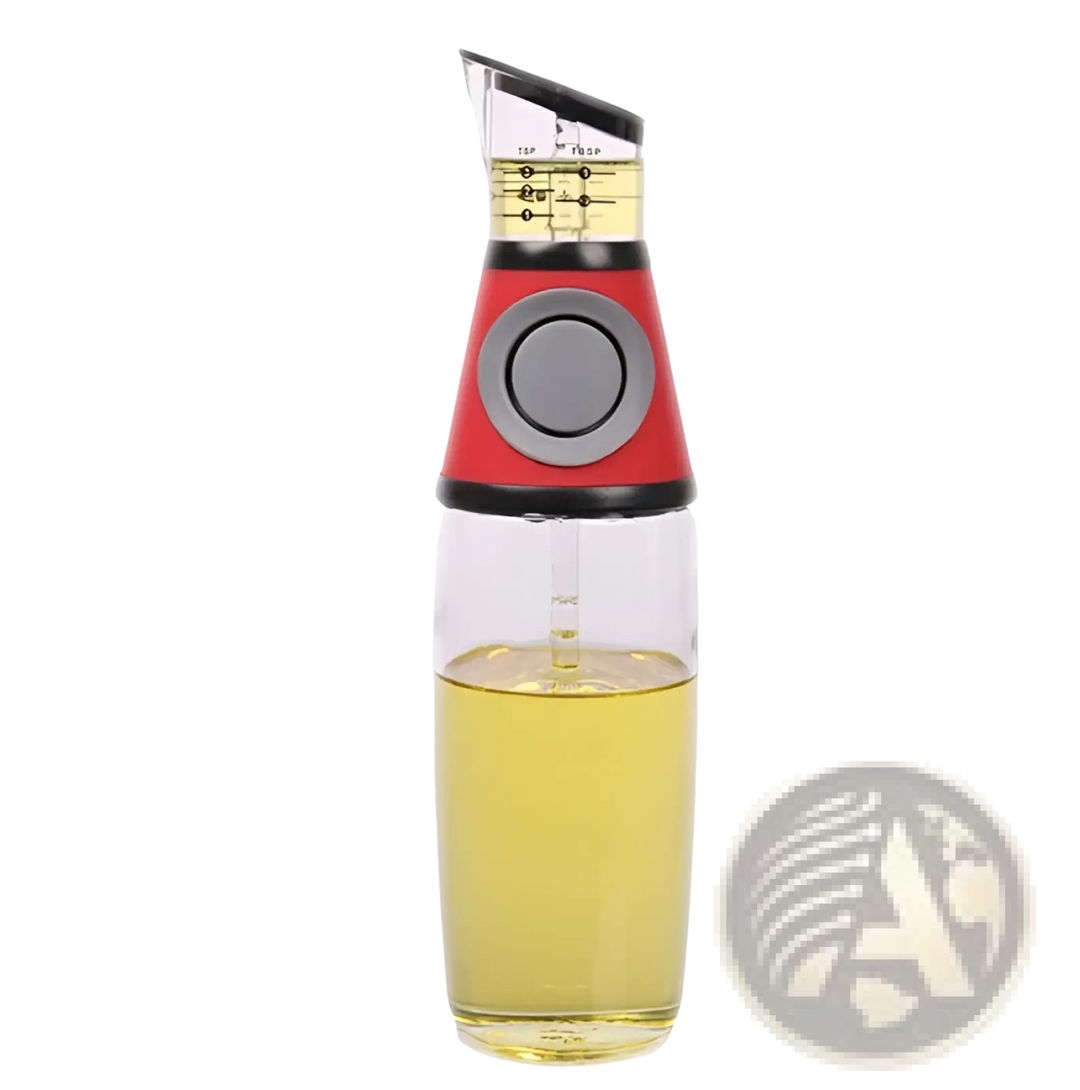 Glass oil dispenser with red base, clear body, and precision measuring cup for yellow oil.