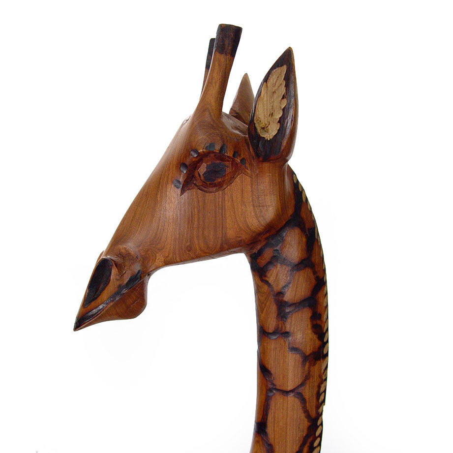 Olivewood giraffe head and neck close-up with carved textured wood pattern