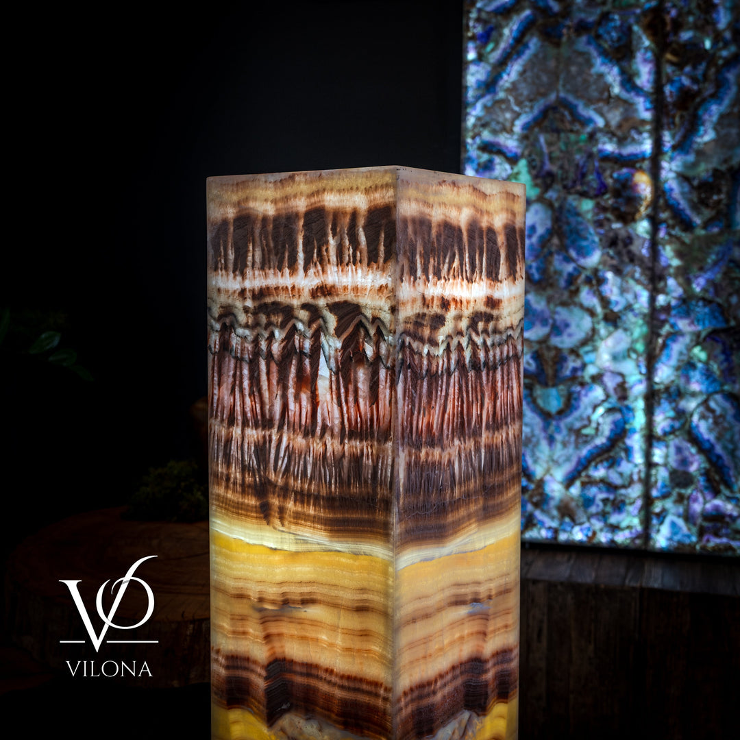 Square floor lamp front view with amber-and-brown drip patterns and gray base