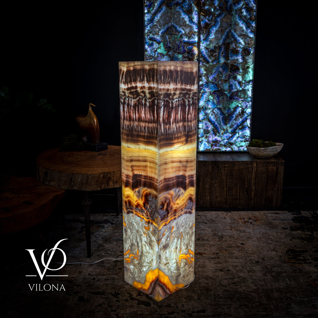 Square floor lamp front view with amber highlights and gray resin base with orange flare