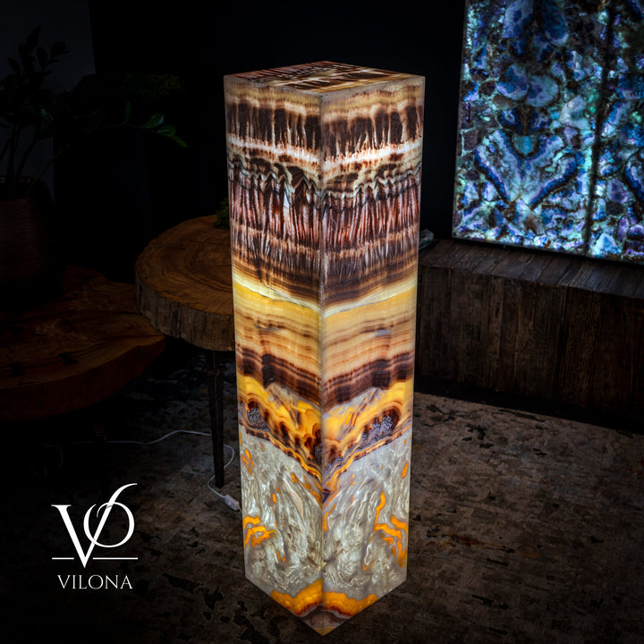 Square floor lamp angled view showing amber top, brown mid, and gray resin base