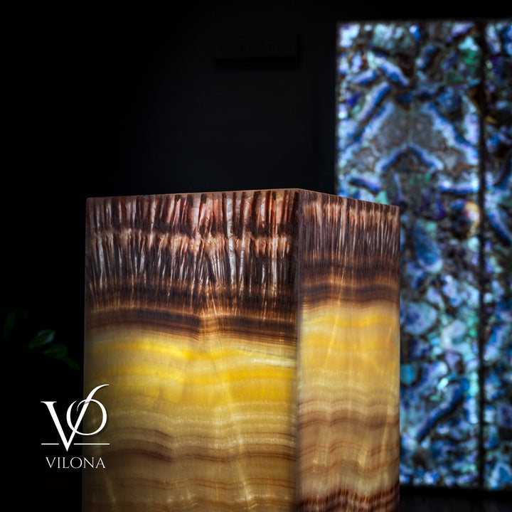 Close-up view of square floor lamp shade with golden and brown striated pattern