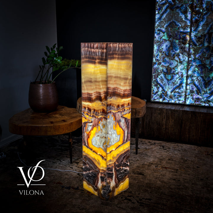 Square floor lamp with amber, gold, and gray onyx-style patterned shade