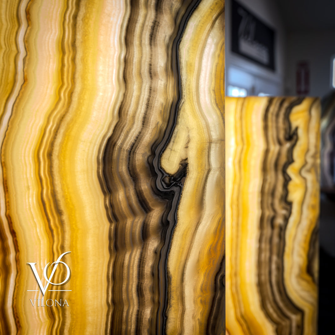Close-up of amber onyx lamp shade with dark curved veining and glowing glow-through areas