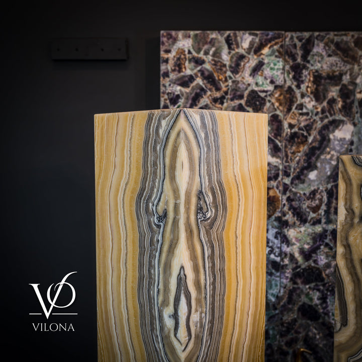 Square onyx floor lamp front view with vertical golden, white, and gray striations