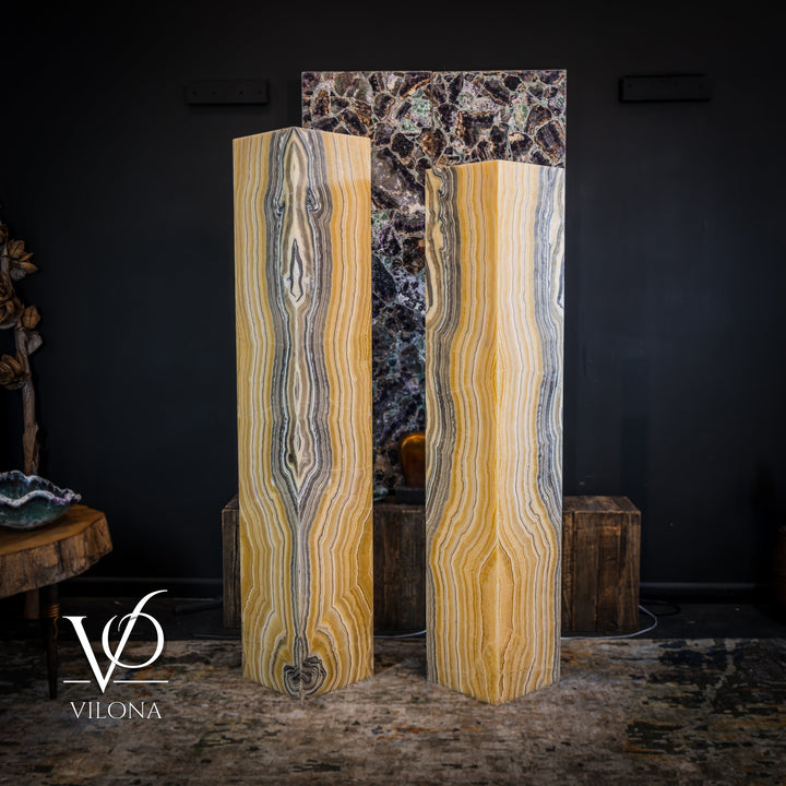 Pair of square onyx floor lamps, two tall stone blocks with golden and gray stripes