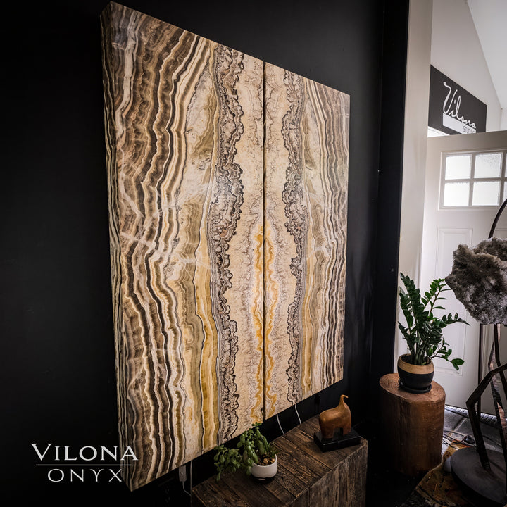 Onyx wall panel with light cream, beige, and gray vertical striated patterns.