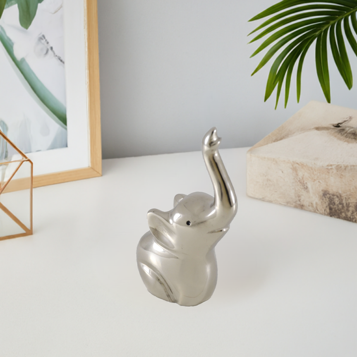 Silver elephant ring holder figurine, front view, raised trunk