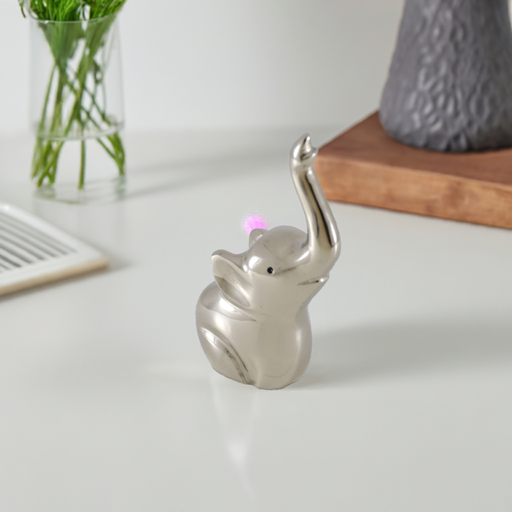 Silver elephant ring holder figurine, side view, raised trunk