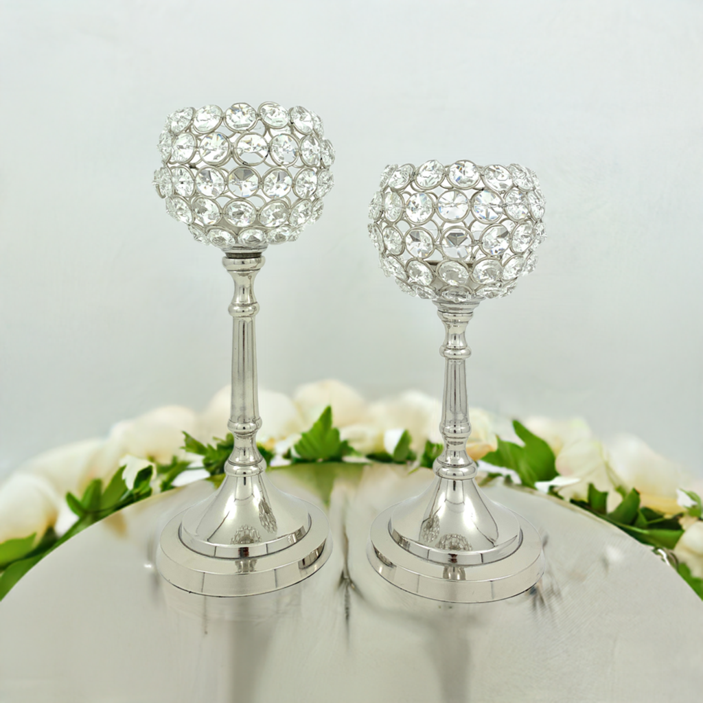 Two silver crystal candle holders with round bases and clear beaded hurricane shades