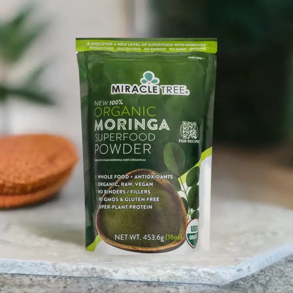 Miracle Tree organic moringa superfood powder pouch on light surface