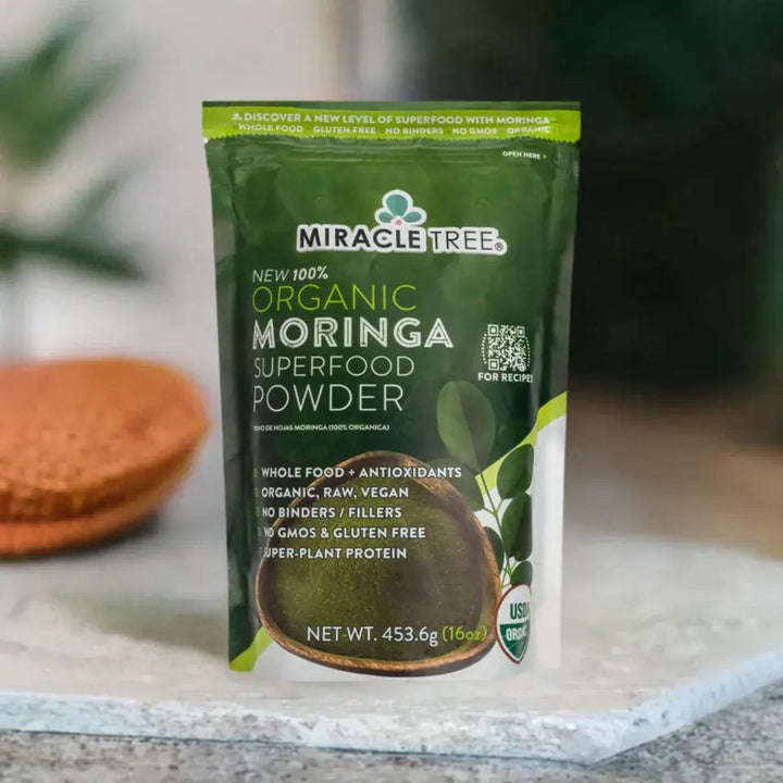 Miracle Tree organic moringa superfood powder pouch on light surface