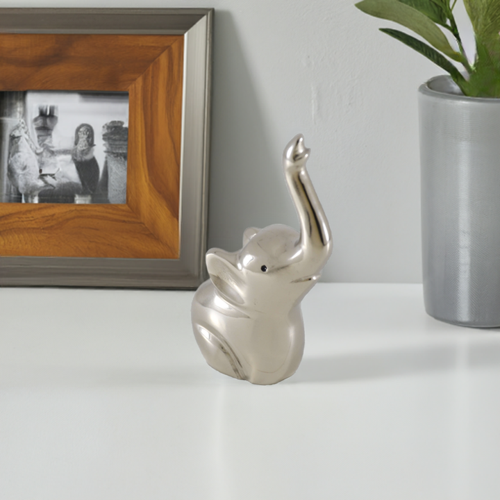 Silver elephant ring holder figurine with raised trunk for rings