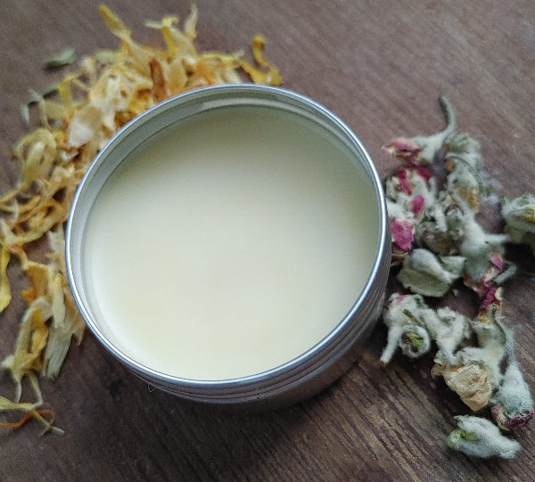 Round natural lip balm tin with pale balm surface