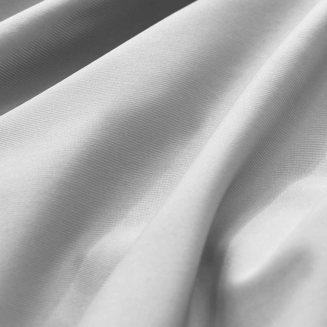 Cooling pillowcase fabric close-up, smooth light weave texture