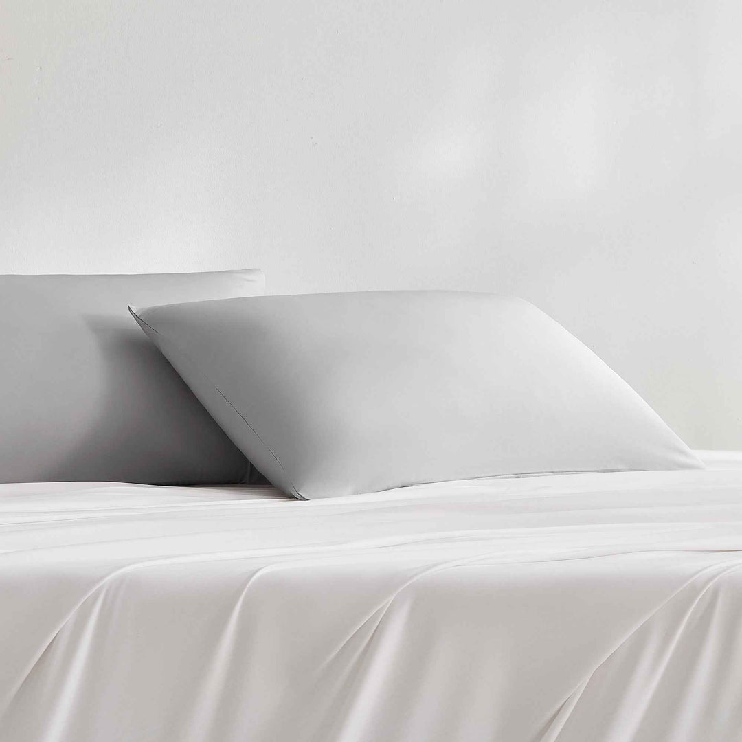 Cooling pillowcase on bed, light gray, smooth envelope style