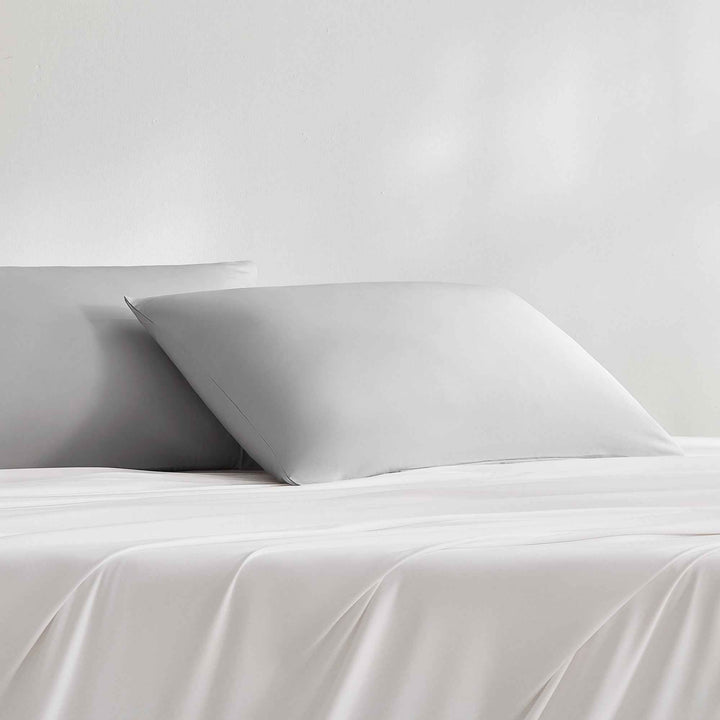 Cooling pillowcase on bed, light gray, smooth envelope style