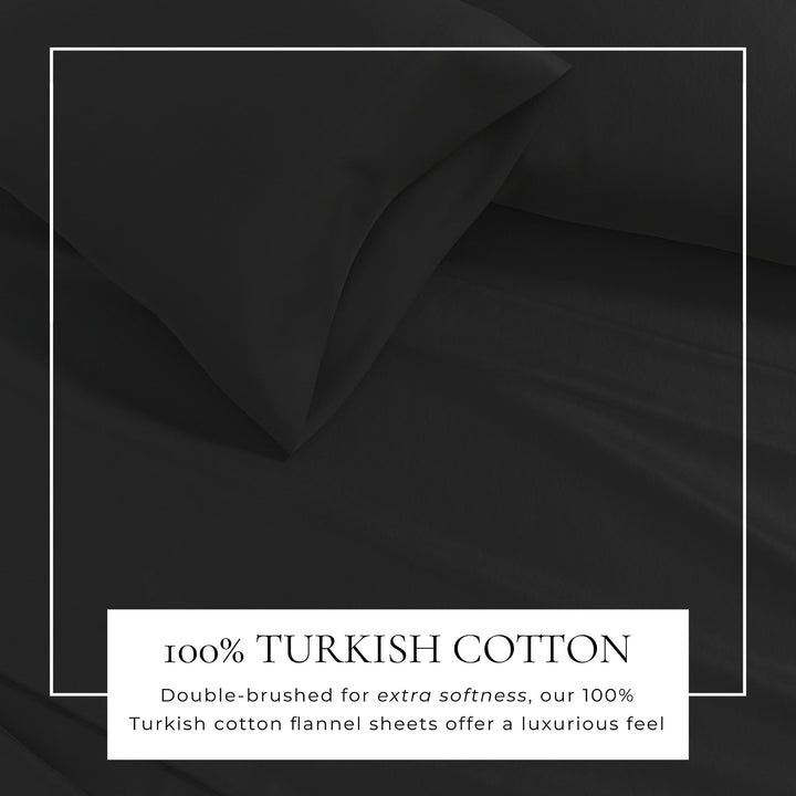 Cotton solid flannel sheet fabric close-up in dark black, smooth wrinkle texture
