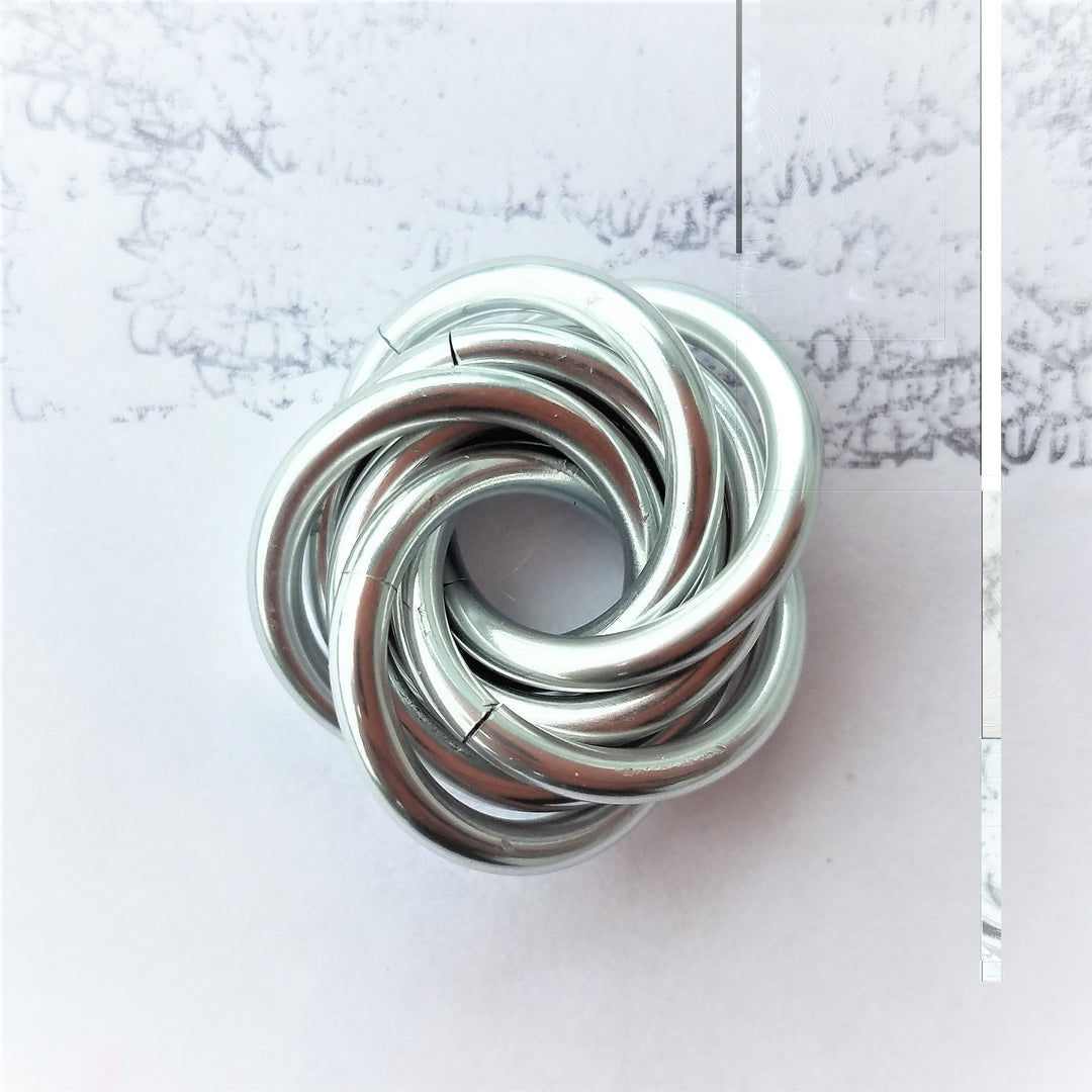 Swirled metallic fidget stress ball, silver and dark gray glossy loops
