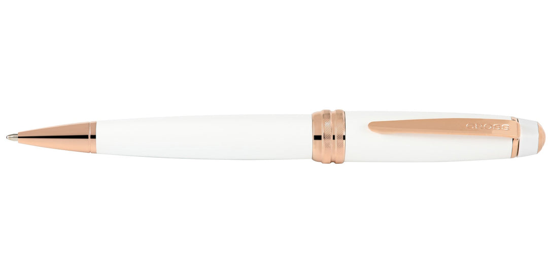 Pearlescent white ballpoint pen with rose-gold ring accents and metal tip