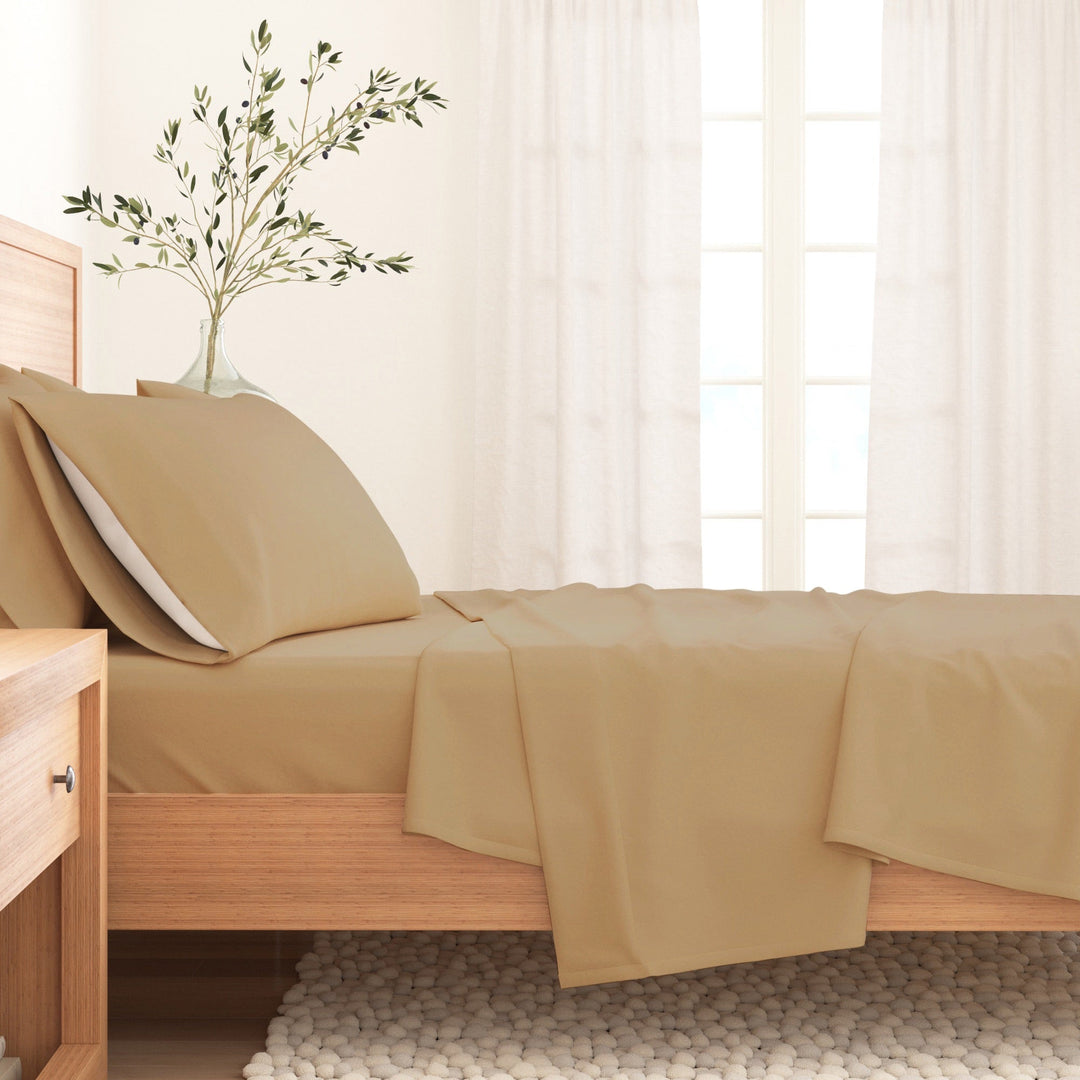 Camel cotton flannel sheet set with pillow and neatly folded flat sheet on bed