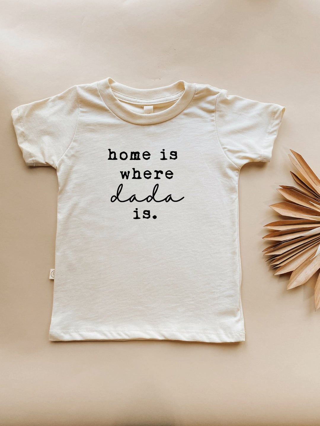 Kids organic T-shirt in cream, short sleeves, 'home is where dada is' front print.