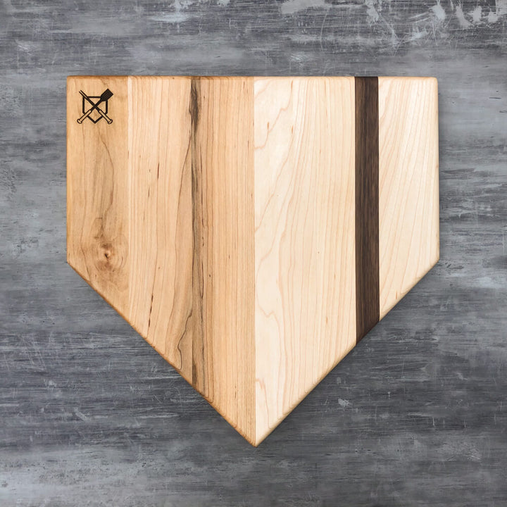 Home plate cutting board, light wood with dark center panel and engraved crossed logo