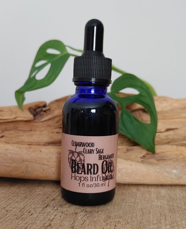 Hydrating beard oil bottle with black label text &