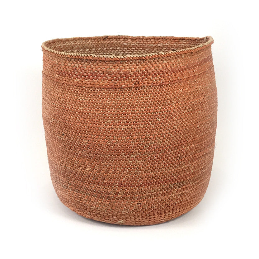 Tall round woven basket, rust-brown with braided rim and open mouth