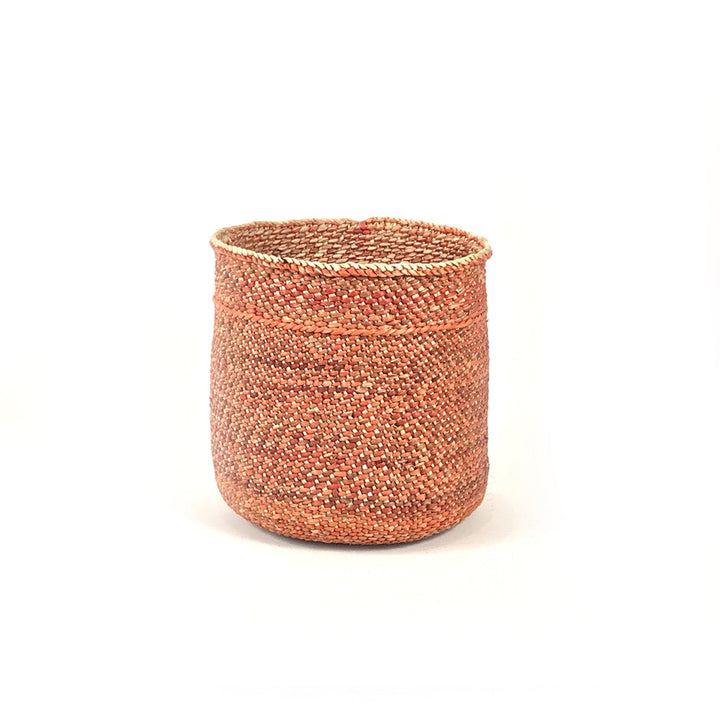 Mini round woven basket in rust-brown with braided rim and open top