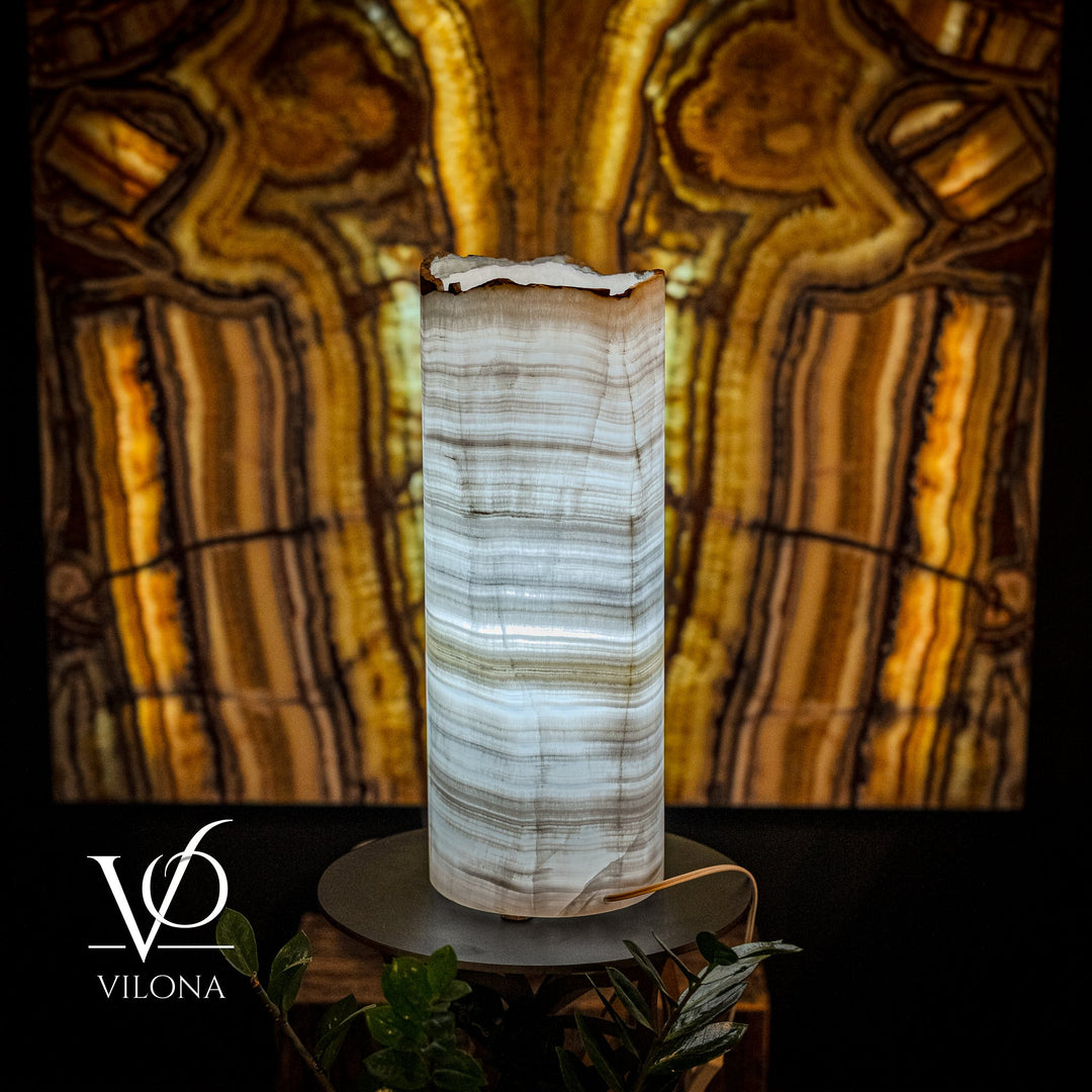 Table lamp with cylindrical onyx shade, white and light-blue veining, on round base