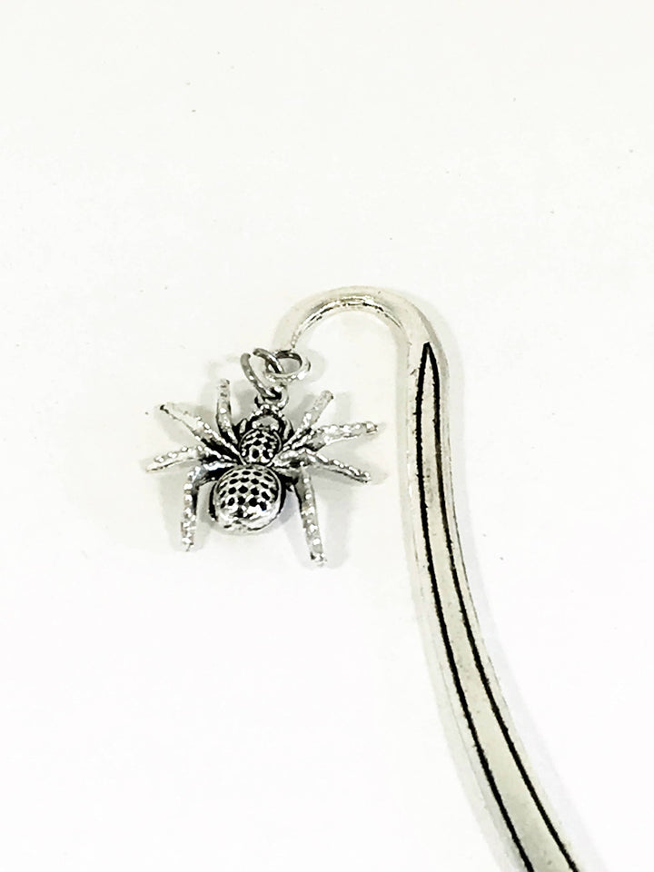 Spider charm bookmark detail: arched silver clip with small spider ornament