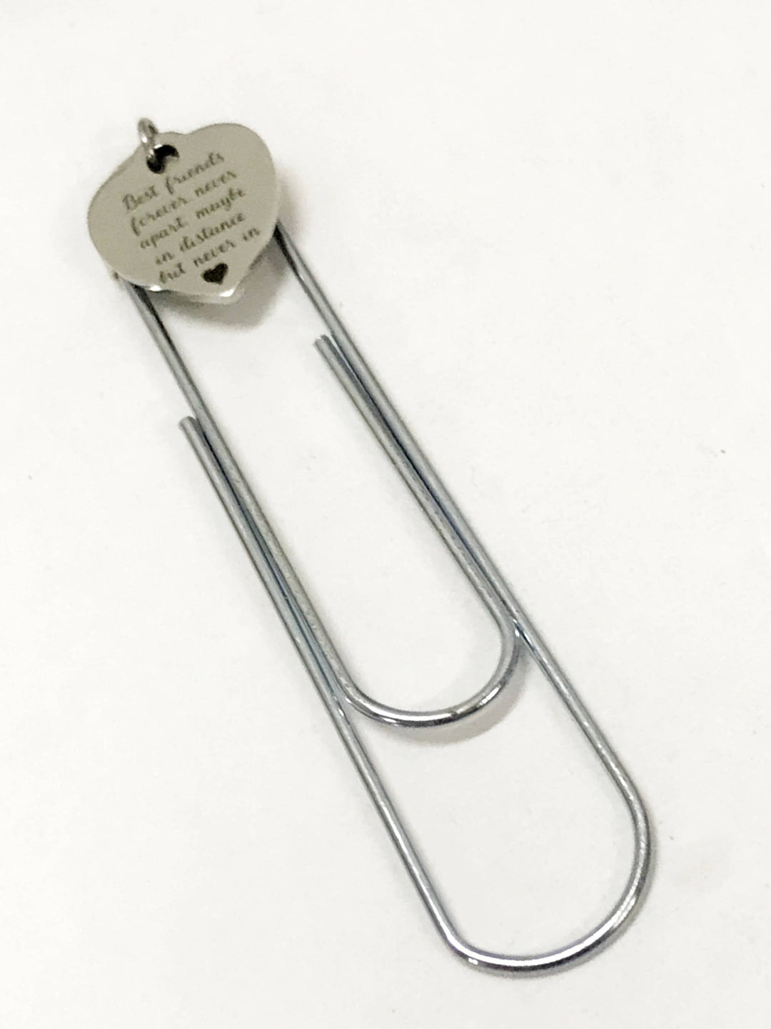 U-shaped paper clip bookmark with round heart tag attached